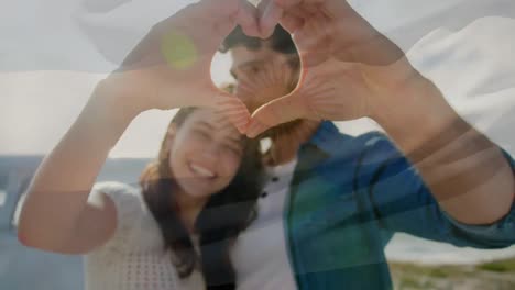 Animation-of-waving-flag-of-argentina-over-couple-having-fun-on-the-beach