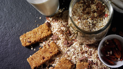 granola bars with jar of muesli and milk 4k