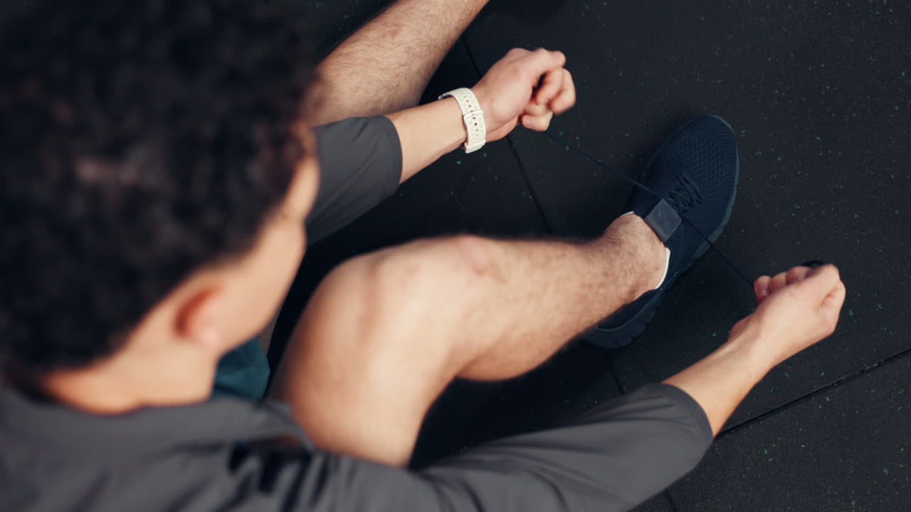 Man Tying Shoelaces at the Gym