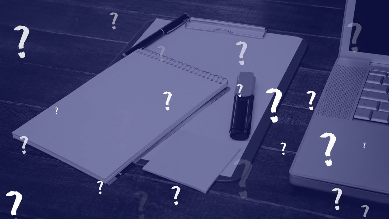 Animation of question marks floating over notepads and laptop on office desk