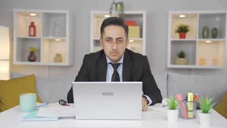 home office worker man making negative gesture at camera.