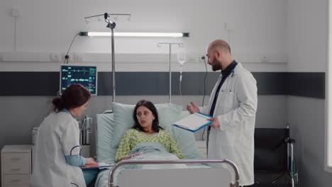 specialist doctors monitoring sick woman discussing sickness treatment