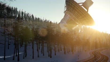 the observatory radio telescope in forest at sunset