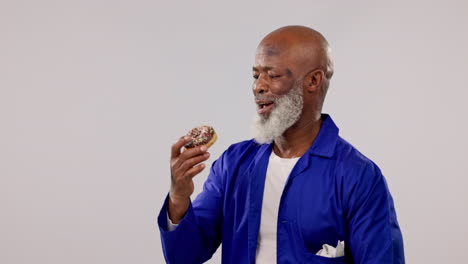 senior man, mechanic or eating donut with smile