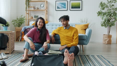 couple packing for a trip - travel vlog