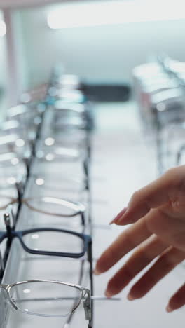 eye glasses on the shelf. selection of modern eyeglasses rims at optician's store