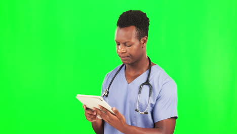 Doctor,-black-man-and-tablet-by-green-screen