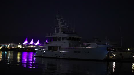 illuminated yachts and harbor at night