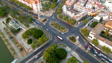 descending overhead shot of barqueta bridge and torneo street in seville