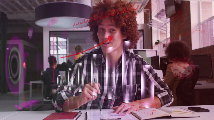 Man sketching in studio, starting pink overlays and arrow animating over face while sharing ideas