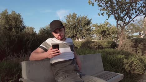 bored young men checking smart phone content