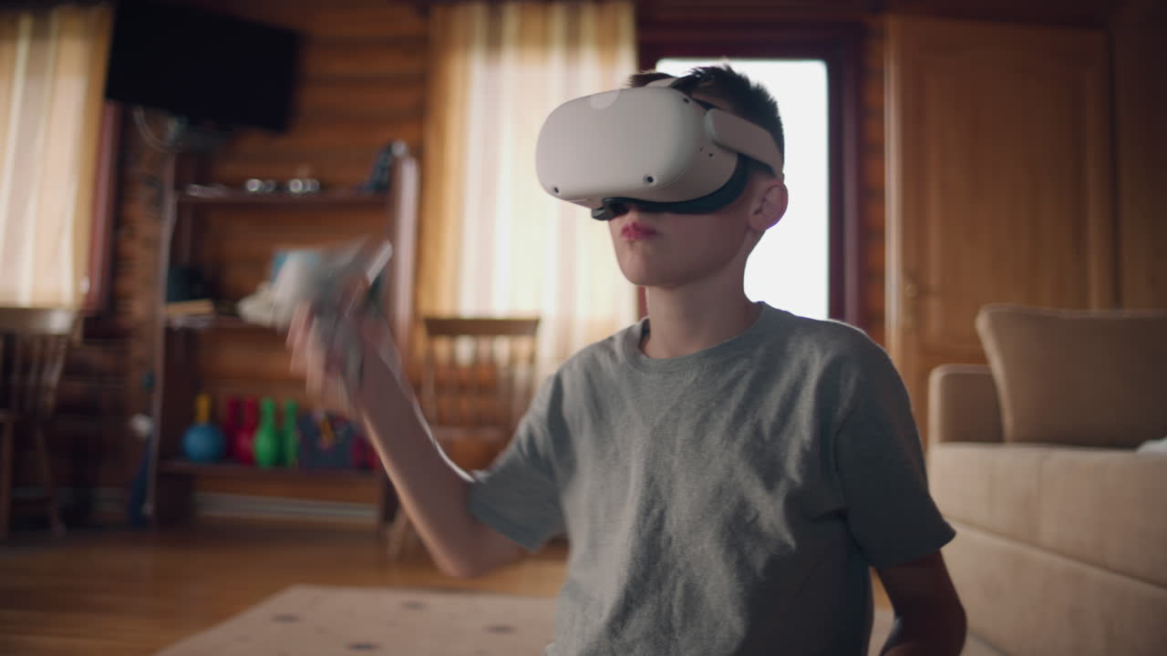 Boy playing VR game at home