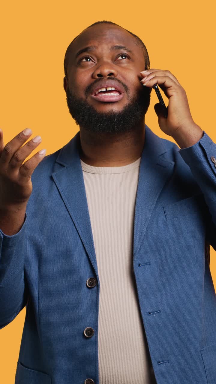 Vertical video Man having thoughtful conversation with friend during telephone call