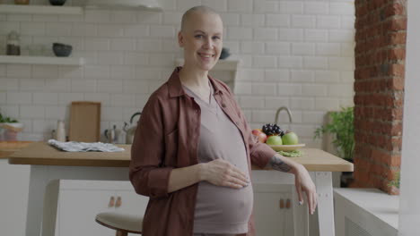 happy pregnant woman in the kitchen