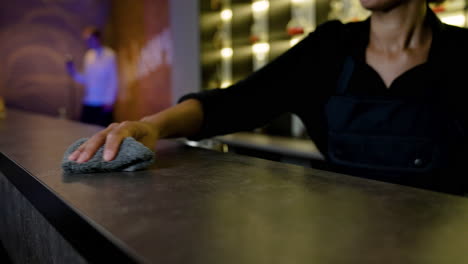 bartender cleaning the counter