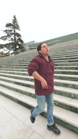 singer performing on urban stairs