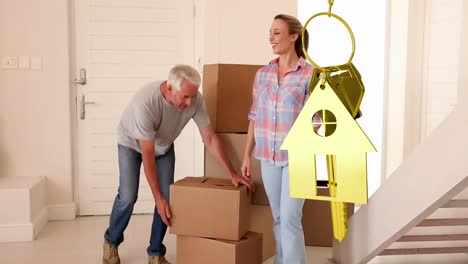 llaves de la casa y llaves colgando con la casa en el fondo
