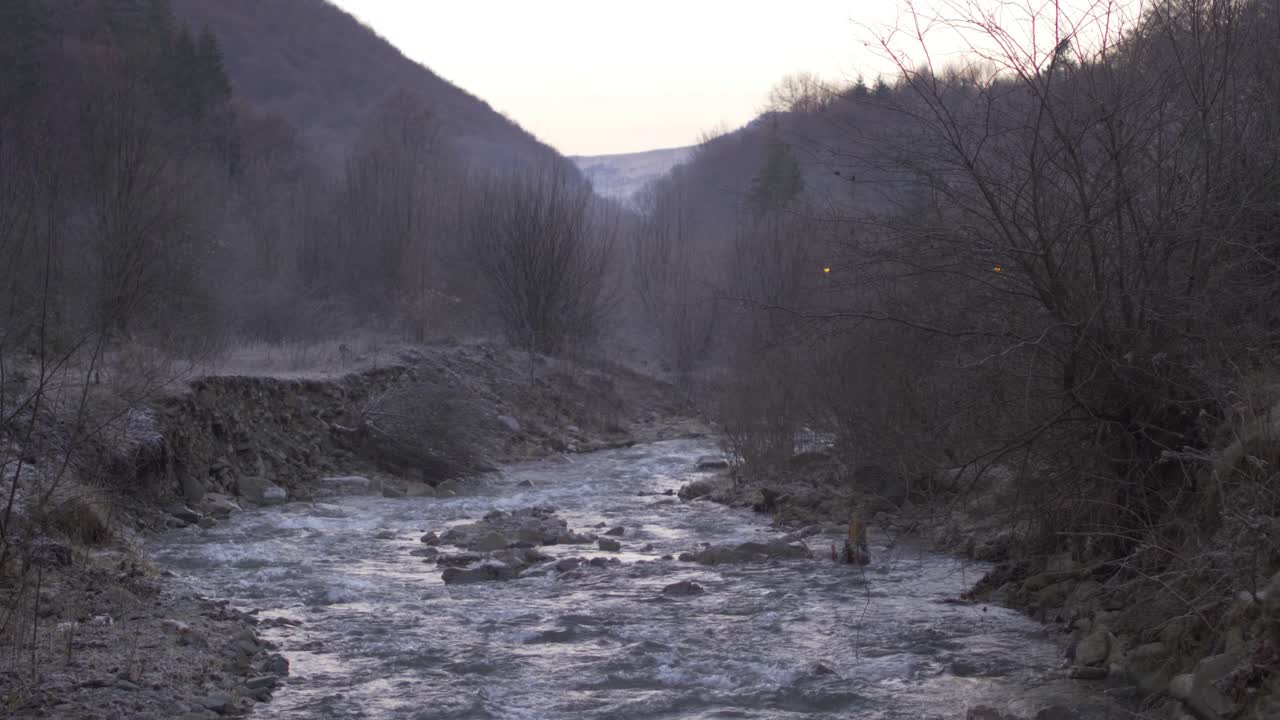 A wonderful river in the Doftana Valley in Romania. The wonderful landscape reveals mountain rocks, frozen plants and the crystal clear water of the river. Everything in a fairytale landscape