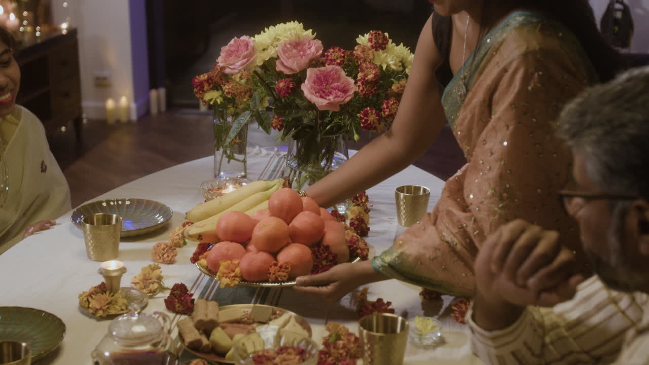 Family Celebration with Traditional Indian Food and Clothing