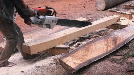 Medium-Shot-of-a-Chainsaw-Cutting-Through-Wood