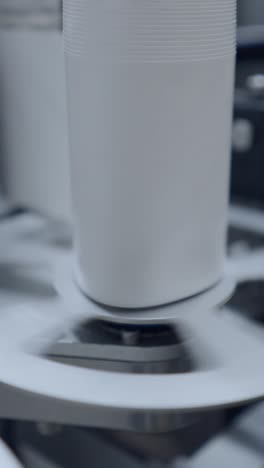 close-up of a cylindrical object rotating on an industrial machine