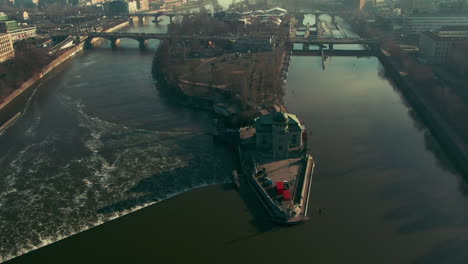 drone flight over prague vlatava river showing bridges castle park and buildings winter sunshine