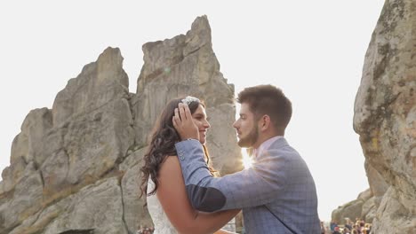 groom with bride near mountain hills. wedding couple in love. sunbeams