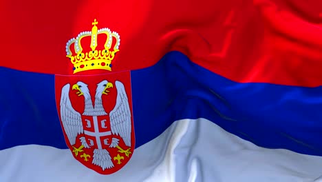 serbia  flag waving in wind slow motion animation . 4k realistic fabric texture flag smooth blowing on a windy day continuous seamless loop background.