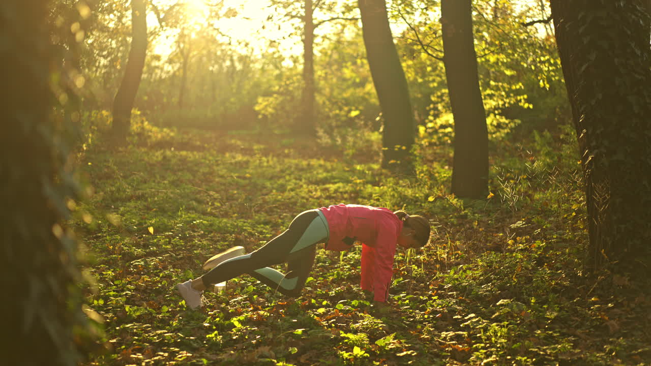 Woman doing various exercises in a sunny park
