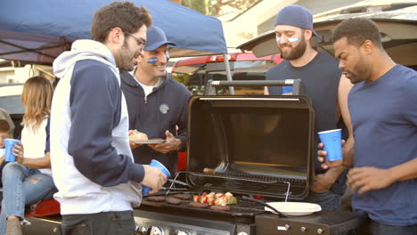 Slow-Motion-Shot-Of-Sports-Fans-Tailgating-In-Parking-Lot