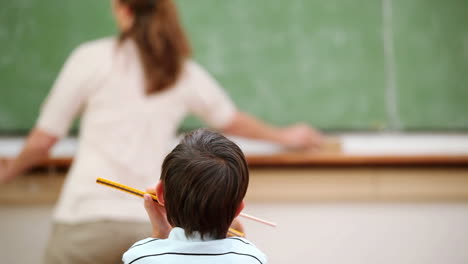 Boy-listening-to-his-teacher