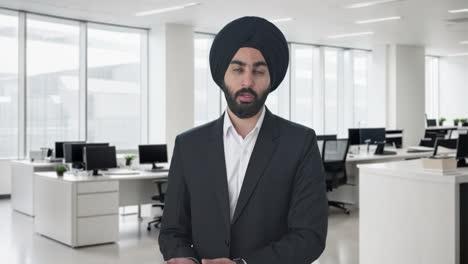 serious sikh indian businessman talking