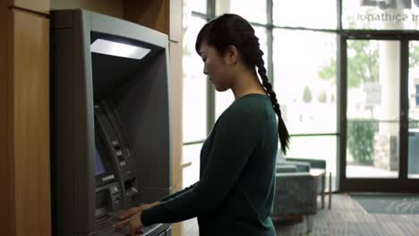 a user interacting with an atm machine in a bright, inviting lobby environment, showcasing the convenience of modern banking technology