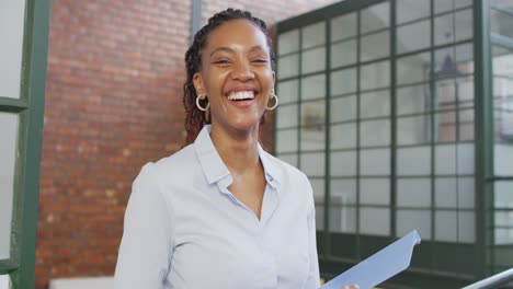 portrait of happy african american businesswoman at office