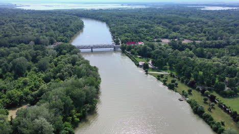 Left to right drone shot from a bridge crossing the river Tisza in Hungary