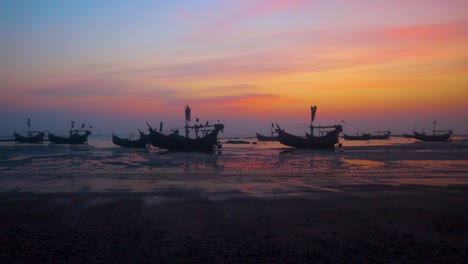 Saint-Martin-island-sunset,-traditional-Caribbean-fishing-boats-on-beach