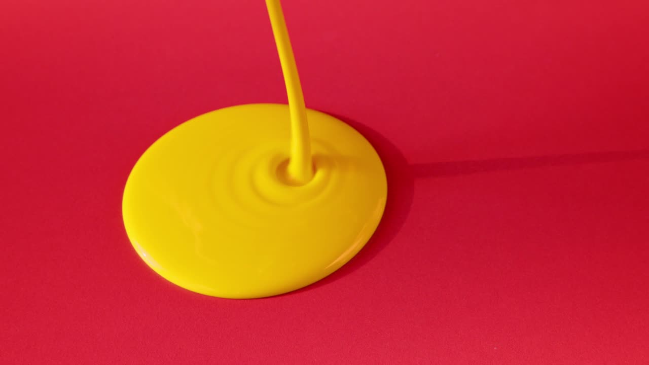 Yellow Paint Drip on Red Background