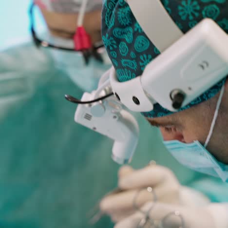 otoplasty surgery. correction of protruding ears. team surgeon at work in operating room.