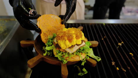 final touch: perfectly stacked cheeseburger ready to serve