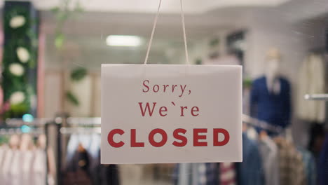 closed sign on elegant clothing store