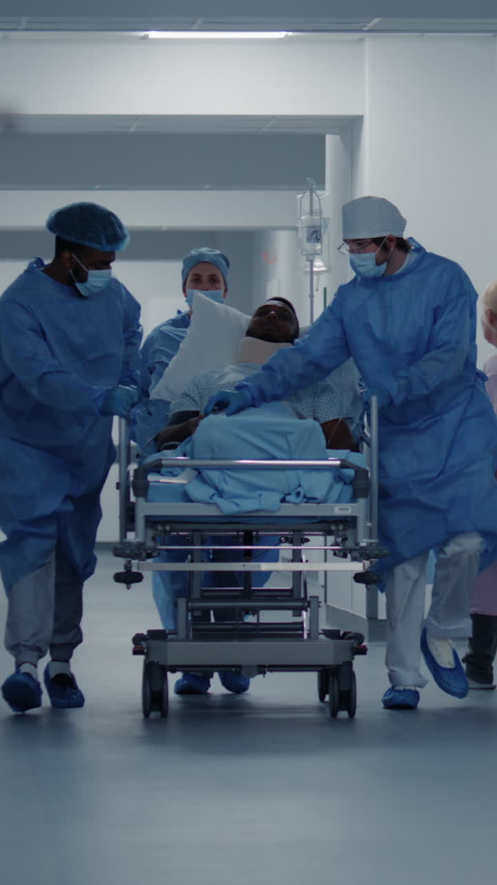 Doctors push stretcher with man to surgery room 4k 2025 08 04 21 29 19 utc.mov | african american, assistance, care, caucasian