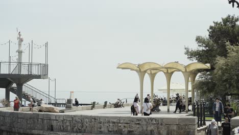 coastal promenade with people and architectural features