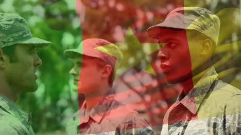 waving cameroon flag against soldier saluting his army sergeant at training camp