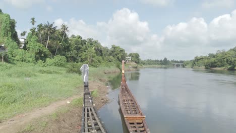 the aranmula uthrittathi vallamkali or aranmula boat race wooden snake boat in aranmula ,kerala