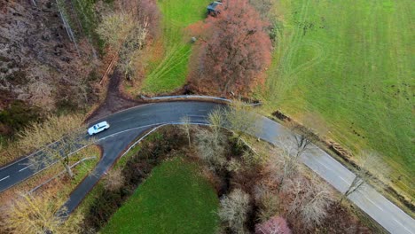 Driving-Through-Paradise:-A-Bird's-Eye-View-of-Bruchhausen's-Scenic-Roadways-cars-driving-tight-curvy-road