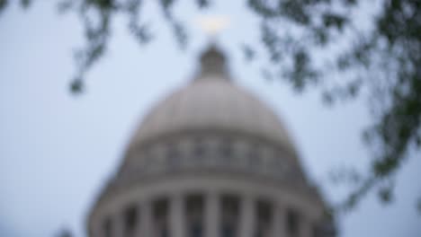 rack focus out and in: stormy skies over the mississippi state capitol building. jackson, ms