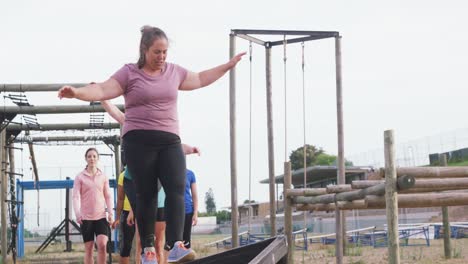 caucasian woman exercising at bootcamp