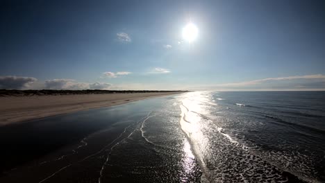 Beautiful-ocean-waves-crashing-on-the-shore-on-a-perfect-sunny-day-aerial-footage