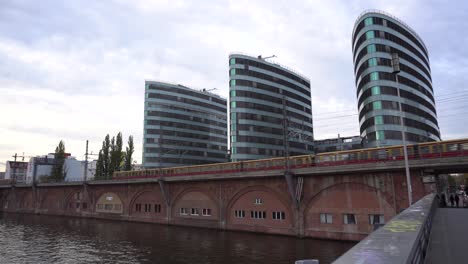 public transport train of sbahn in berlin at evening with modern towers