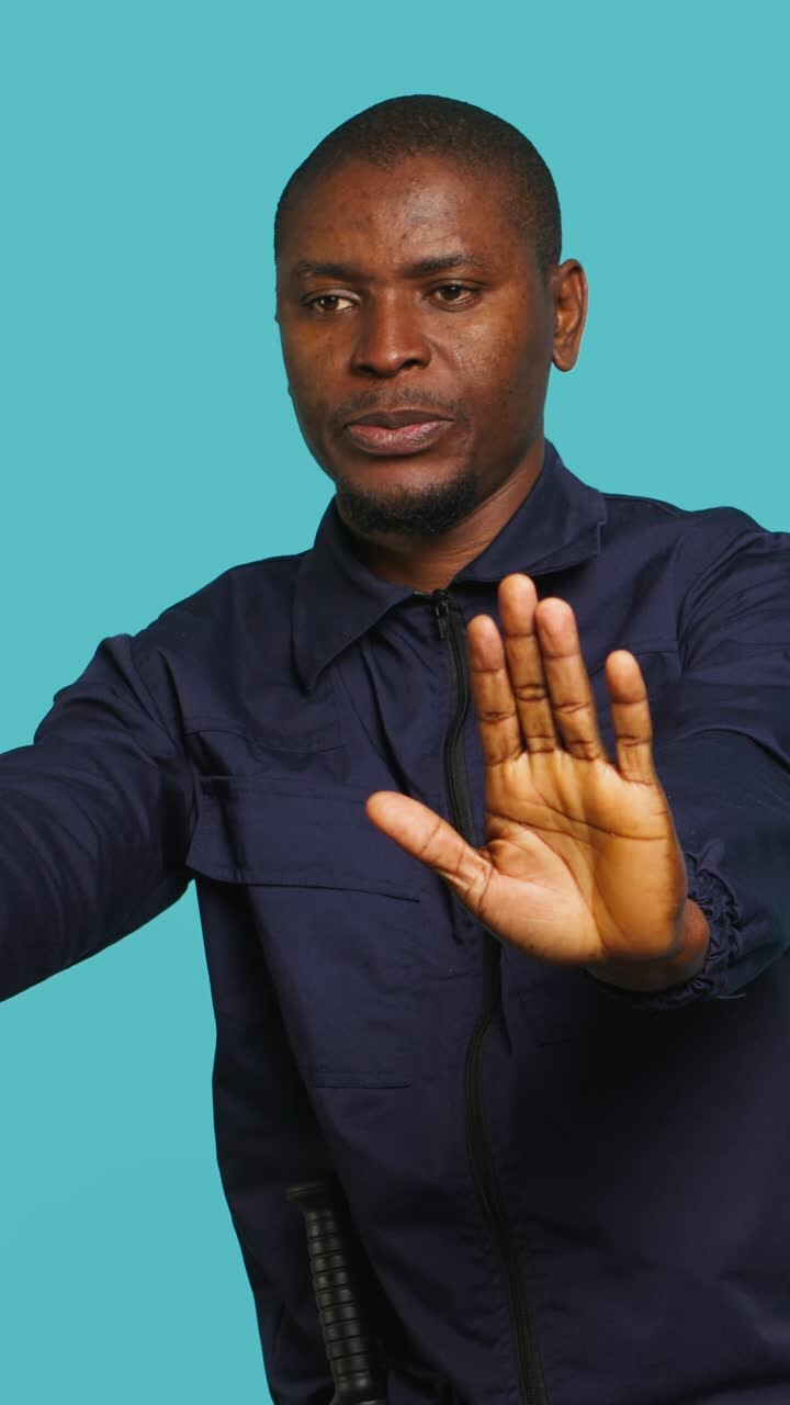 African American Man Making Stop Gesture with Hands